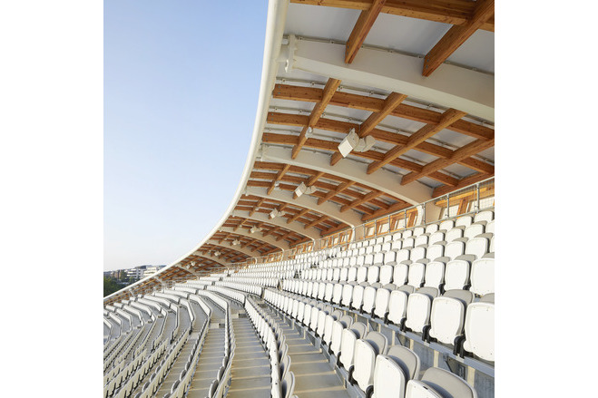 Spectators beneath the tensile fabric stadium roof at Lord's Cricket Ground