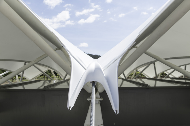 Swallow-shaped GRP rainwater deflector on the membrane roof at Château La Coste